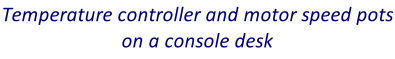 Temperature controller and motor speed pots on a console desk